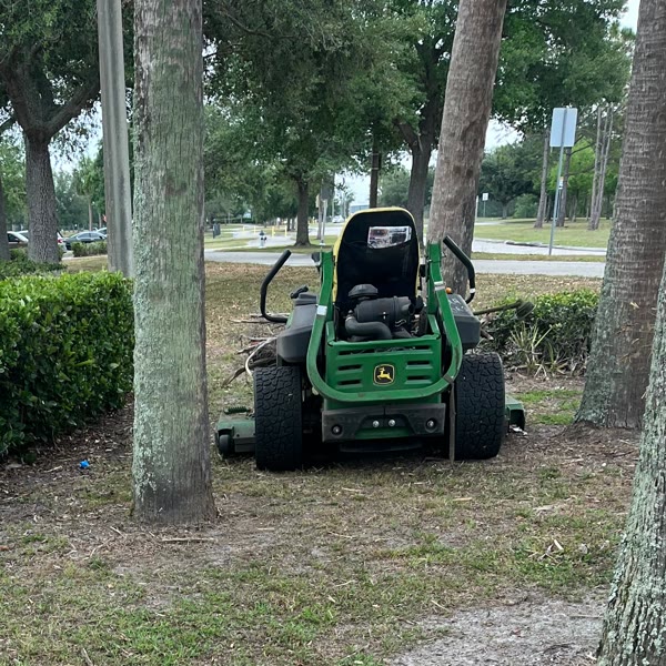 Jeune-P commercial zero-turn mower parked on a job site